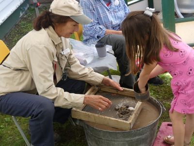 child panning for gold